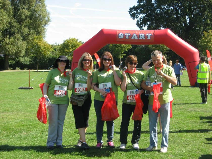 Posing with our medals after crossing the finishing line